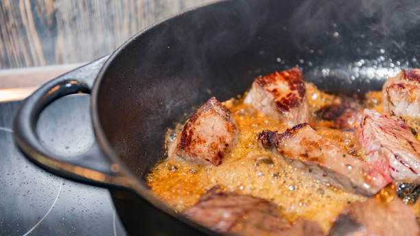 istock meat in a pan fry 1124227579