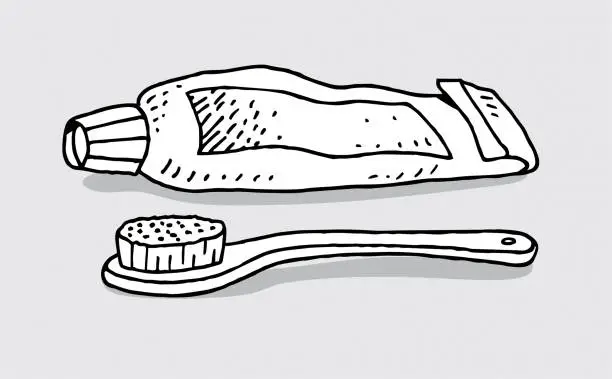 Vector illustration of Hand drawn tooth paste and brush