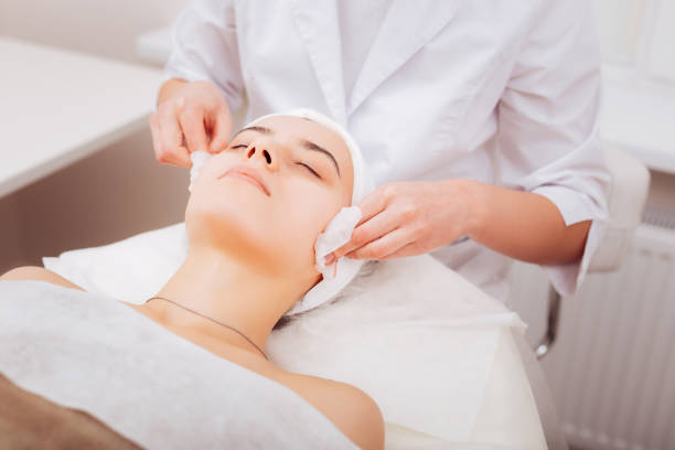 istock Nice attractive woman having her skin cleansed 1124229431