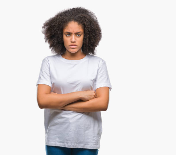 istock Young afro american woman over isolated background skeptic and nervous, disapproving expression on face with crossed arms. Negative person. 1124229727