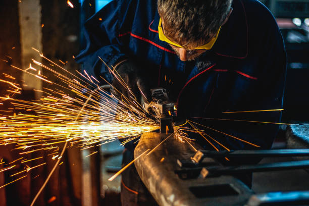 istock Worker Use Electric Grinder Cutting Metal 1124229798