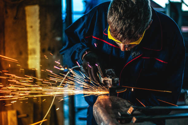 istock Worker Use Electric Grinder Cutting Metal 1124229869
