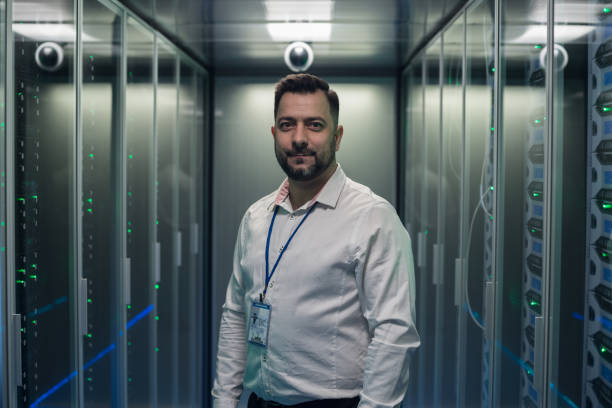istock Smiling engineer in corridor of data center 1124233477