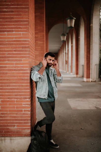 istock Young man listening with his headphones 1124235523