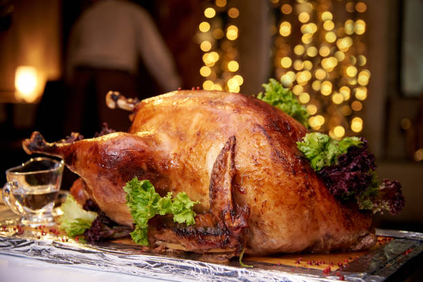 istock Appetizing baked turkey close-up on a background of bright bokeh. 1124236345