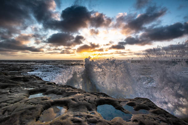 istock Rocky Pacific Ocean coastline at dusk with clouds 1124238163
