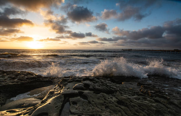 istock Rocky Pacific Ocean coastline at dusk with clouds 1124238166