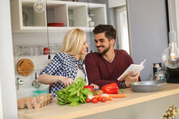 istock Young couple cooking together 1124238417