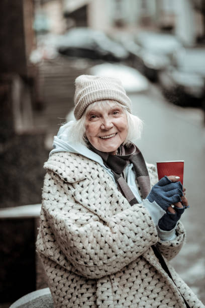 istock Joyful nice aged woman feeling absolutely happy 1124238555