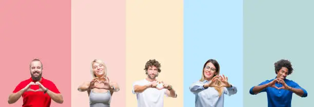 Photo of Collage of group of young people over colorful vintage isolated background smiling in love showing heart symbol and shape with hands. Romantic concept.