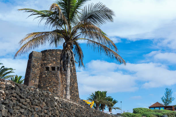 Stone tower in Playa Bastian beach, Lanzarote, Canary islands. VIew of the sea, sandy beach and rocks