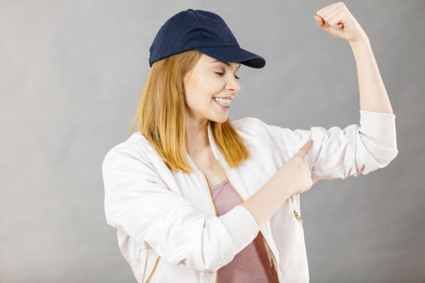 istock Young woman showing her arm muscles 1124240122