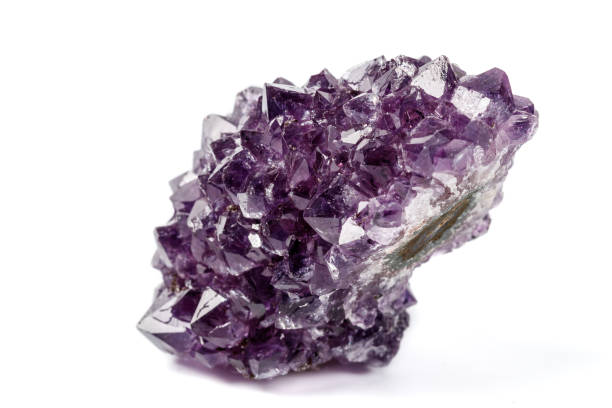 istock Macro mineral stone Amethysts eye crystals on white background 1124242086