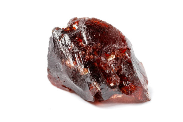 istock Macro mineral stone Garnet Spessartine on a white background 1124242180