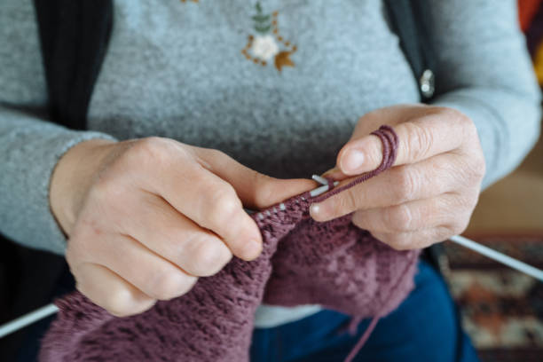 istock Senior woman's hands knitting 1124242431
