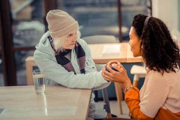 istock Nice pleasant women holding each others hands 1124242599
