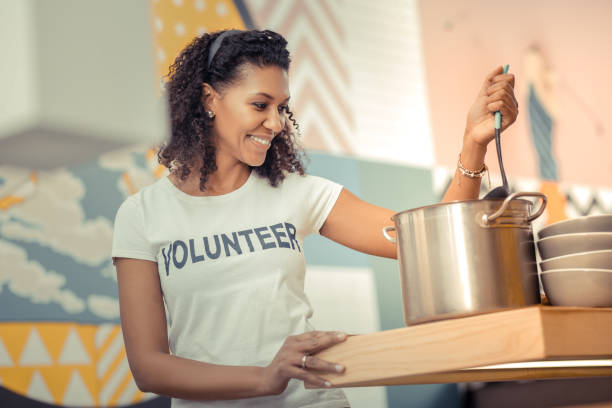 istock Delighted happy woman cooking in the kitchen 1124243146