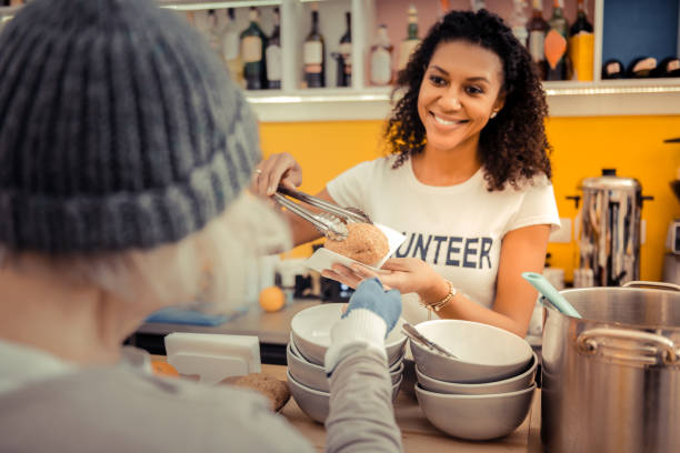 istock Delighted nice woman giving a fresh bun 1124243176