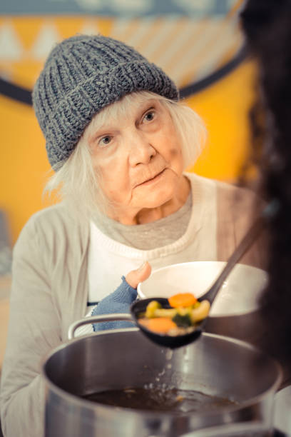 Sad cheerless woman asking for the soup