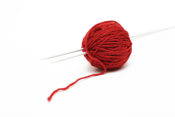 istock clew with needles on a white background, close-up