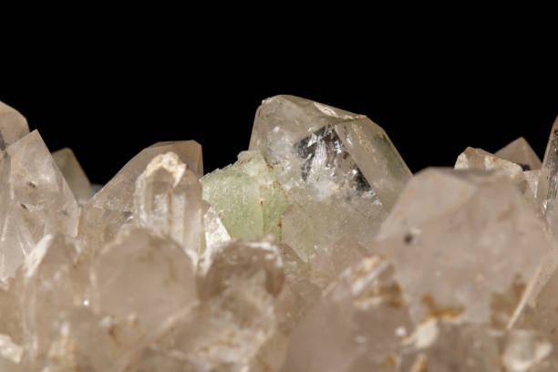 istock Macro mineral stone Prehnite quartz on a black background 1124245114