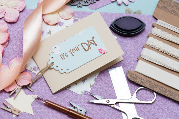 istock scrapbook background. process of creating a postcard - Card and tools with decoration 