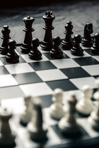 istock Chess board with black and white chess facing each other 1124256434