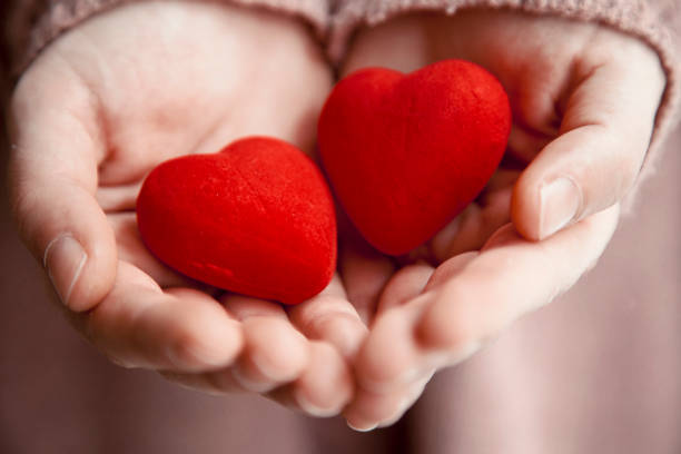 istock Female hands holding hearts.Valentine's day concepts 1124267246