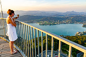 Girl standing on deck of Pyramidenkogel viewing tower in Carinthia.
