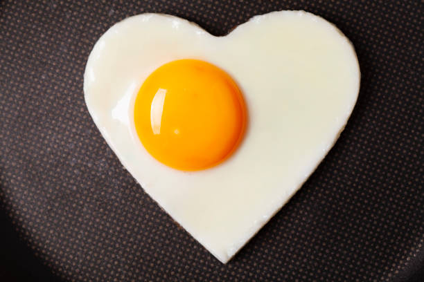 istock Valentine's breakfast Fried egg in iron form heart crop 1124270744