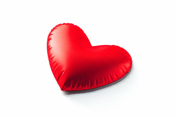 istock Red pillow in the form of heart isolated on white background. 3d rendering. 1124272435