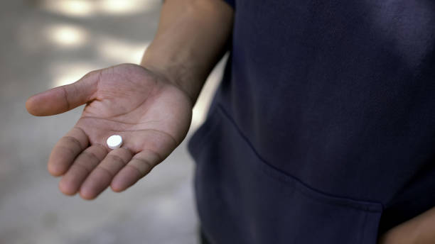 istock Guy trying pill with narcotic stuff, person looking for way to relax, addiction 1124272977