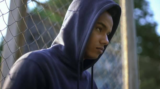 istock Aggressive afro-american teen ready to commit crime, lack of proper upbringing 1124273088