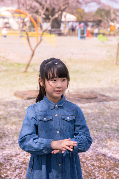Little girl in public park in spring