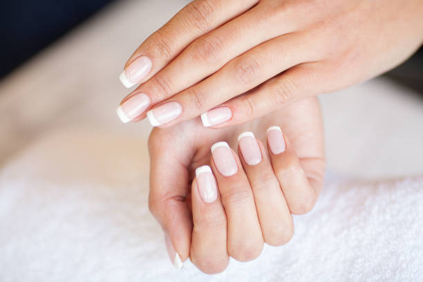 istock Manicure. Skillful master of manicure holding file in her hands while working in her beauty salon 1124277686