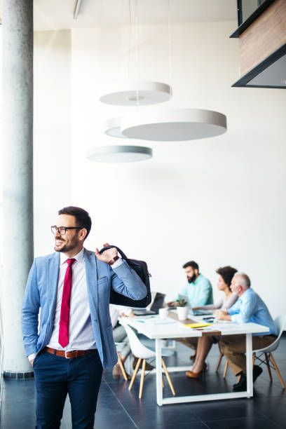 istock Young male businessman going home from work 1124280730