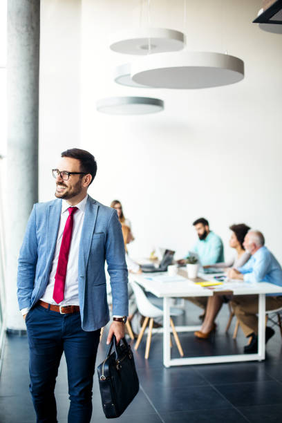 istock Young male businessman going home from work 1124280758