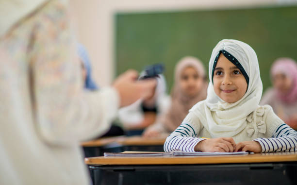 istock Muslim girl listening in class 1124283516