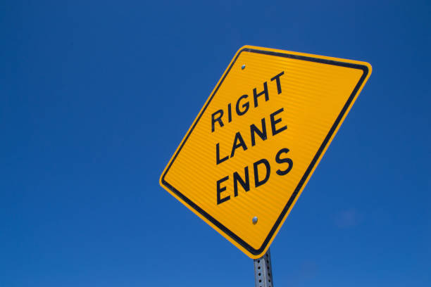 istock Right lane ends street sign 1124287214