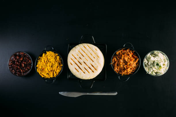 Top view of South American food called arepa and different ingredients stock photo