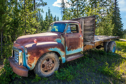 Fort Fraser, British Columbia, Canada. June 17, 2018. Old rusted car in the forest