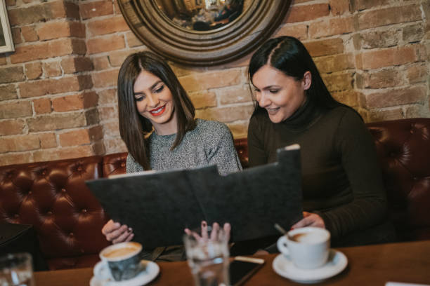 istock The two best friends look at menu in the cafeteria 1124291981