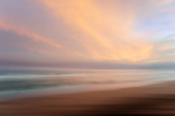 istock beach, sand, clouds, sunrise, sea 1124292124