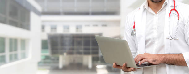 istock Doctor using laptop computer at the hospital. 1124296492