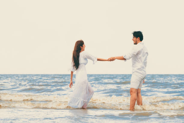 istock Couple going honeymoon on tropical beach in summer 1124298124