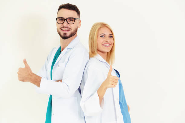 istock Portrait of confident doctors on white background. 1124298899