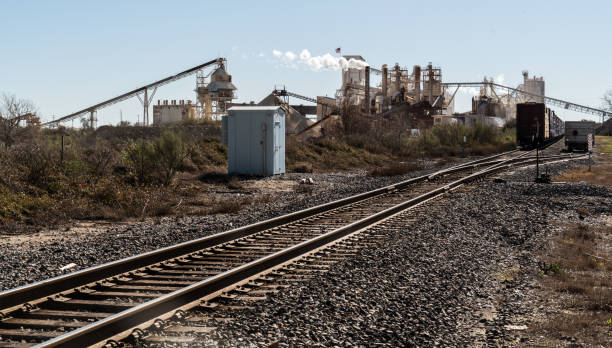 istock Industrial revolution mining factory on railroad tracks 1124299175