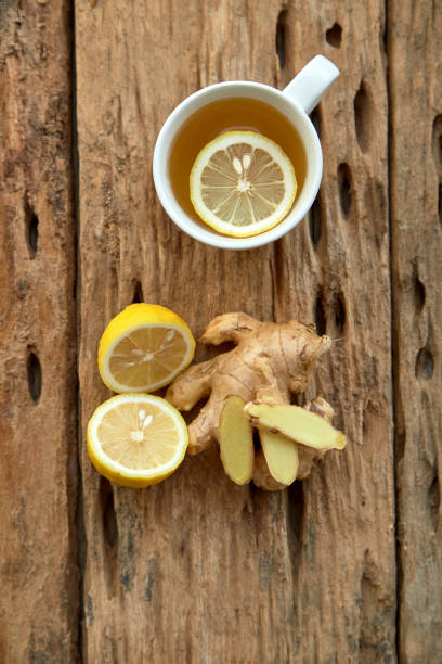 istock Cup of tea with lemon and ginger on a old wooden table 1124299211