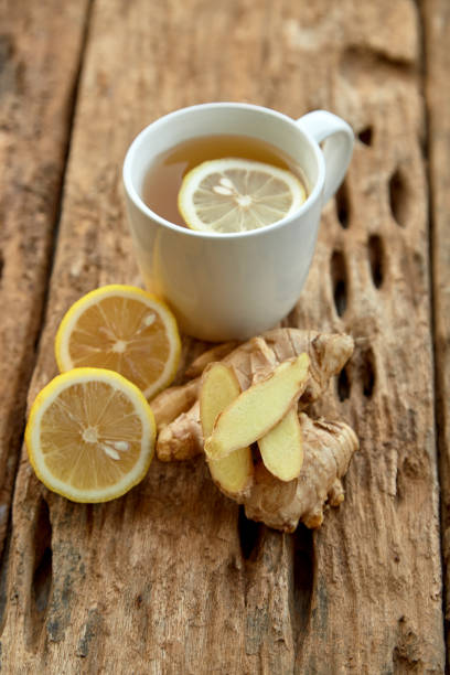 istock Cup of tea with lemon and ginger on a old wooden table 1124299279