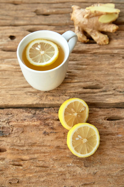 istock Cup of tea with lemon and ginger on a old wooden table 1124299292